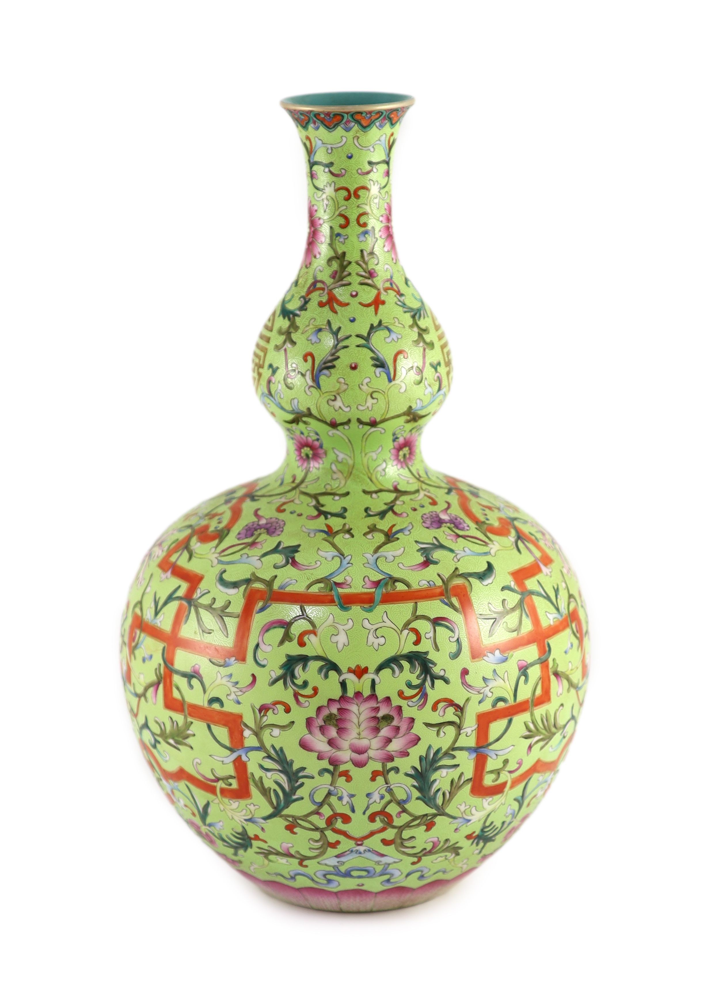 A Chinese lime green sgraffito ground double gourd vase, Qianlong mark but later, 40cm high